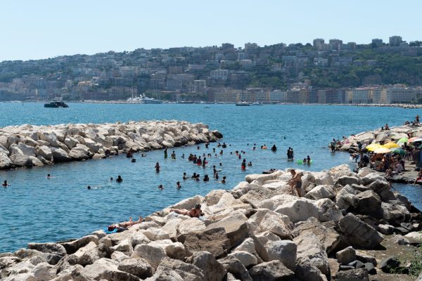 NAPLES, ITALY - JULY 11: People sunbath and swim during the African heatwave in Naples on July 11, 2026. A new and more intense heatwave is sweeping across Italy and Western Europe, with temperatures peaking at 38-41 degrees celsius in southern Italy. (Photo by Eliano Imperato/Anadolu via Getty Images)
