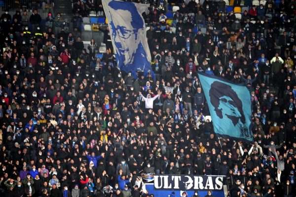 NAPLES, ITALY - NOVEMBER 28: Fans of SSC Napoli with a Flag of Diego Armando Maradona ,during the Serie A match between SSC Napoli and SS Lazio at Stadio Diego Armando Maradona on November 28, 2021 in Naples, Italy. (Photo by MB Media/Getty Images)