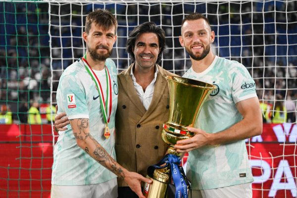 Inter Milan's Francesco Acerbi, Federico Pastorello and Stefan de Vrij celebrates with the trophy after winning the Italian Cup (Coppa Italia) final football match between Fiorentina and Inter Milan at the Stadio Olimpico in Rome, on May 24, 2023. (Photo by Tiziano Ballabio/NurPhoto via Getty Images)