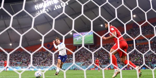 DOHA, QATAR - NOVEMBER 21: (EDITORS NOTE: In this photo taken from a remote camera from behind the goal) Jack Grealish of England scores their team's sixth goal during the FIFA World Cup Qatar 2022 Group B match between England and IR Iran at Khalifa International Stadium on November 21, 2022 in Doha, Qatar. (Photo by Richard Heathcote/Getty Images)