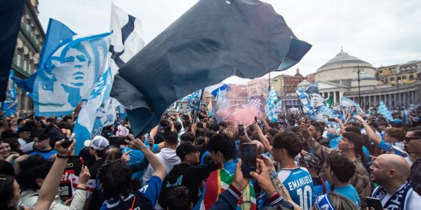NAPLES, ITALY - APRIL 30: Supporters of Napoli celebrate the defeat of Lazio to Inter Milan on April 30, 2023 in Naples, Italy. The city of Naples is preparing to celebrate the victory of the third Scudetto in the Serie A championship. In the streets of the historic center and in the various districts of Naples, decorations, flags and banners have been set up which celebrate the football championship played by the team coached by Spalletti. Napoli could become champions of Italy in advance, if they beat Salernitana at the Campania derby on Sunday at 3 pm at the Diego Armando Maradona Stadium, and in the event that Lazio fail to win away against Internazionale. Napoli has won two Scudetti in its history in the 1986-1987 and 1989-1990 seasons, both victories were obtained with the presence of late football legend Diego Armando Maradona, the Neapolitan fans are awaiting to celebrate 33 years after the last success (Photo by Ivan Romano/Getty Images)