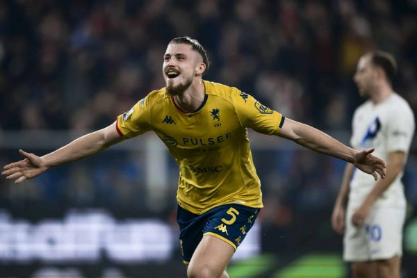 STADIO LUIGI FERRARIS, GENOA, ITALY - 2023/12/29: Radu Dragusin (L) of Genoa CFC celebrates after scoring a goal from a header as Carlos Augusto of FC Internazionale looks dejected during the Serie A football match between Genoa CFC and FC Internazionale. The match ended 1-1 tie. (Photo by Nicolò Campo/LightRocket via Getty Images)