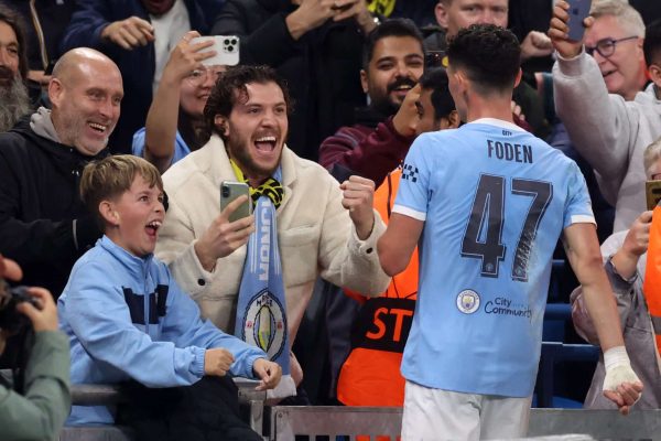 MANCHESTER, ENGLAND - NOVEMBER 05:  Phil Foden of Manchester City celebrates with fans after scoring a goal to make it 1-0 during the UEFA Champions League 2025/26 League Phase MD4 match between Manchester City and Borussia Dortmund at City of Manchester Stadium on November 05, 2025 in Manchester, England. (Photo by Catherine Ivill - AMA/Getty Images)