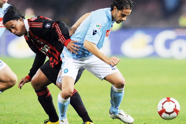 NAPLES, ITALY - OCTOBER 28:  Ronaldinho of AC Milan and Gianluca Grava of SSC Napoli in action during the Serie A match between SSC Napoli and AC Milan at Stadio San Paolo on October 28, 2009 in Rome, Italy.  (Photo by Giuseppe Bellini/Getty Images)