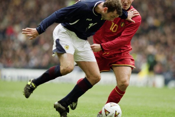 24 Mar 2001:  Don Hutchison of Scotland holds off Walter Baseggio of Belgium during the World Cup 2002 Group Six Qualifying match played at Hampden Park, in Glasgow, Scotland. The match ended in a 2-2 draw.  Mandatory Credit: Ross Kinnaird /Allsport