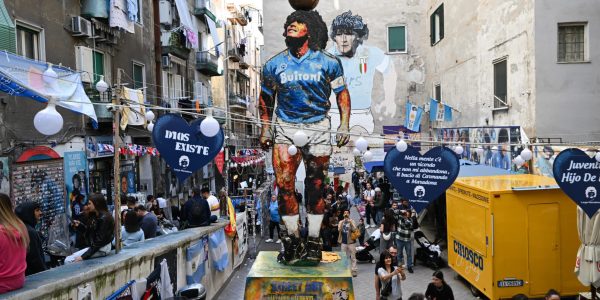 dpatop - 04 November 2025, Italy, Neapel: The "Largo Maradona" in the Quartieri Spagnoli, with its famous mural and sculpture of Diego Armando Maradona, is a magnet for soccer fans and tourists alike. The Argentinian world champion, one of the best footballers in history, played in the city on Mount Vesuvius from 1984 to 1991 and is revered there like a saint. Maradona died on November 25, 2020. Photo: Arne Dedert/dpa (Photo by Arne Dedert/picture alliance via Getty Images)